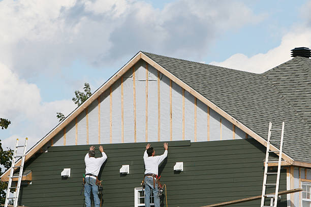 Professional Storm Damage Siding Repair technician working in Waterford, PA